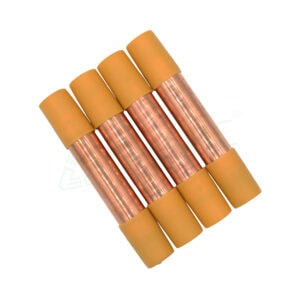Four copper filter driers with yellow caps used in HVAC systems for moisture and debris removal from refrigerant lines.